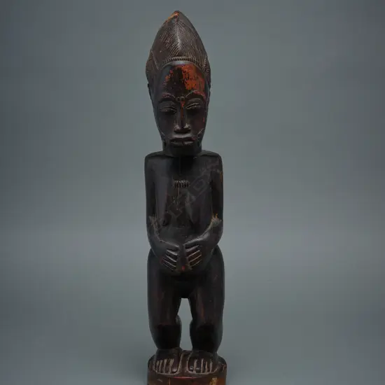 A Baule carved wooden female figure - Ivory Coast - Africa,